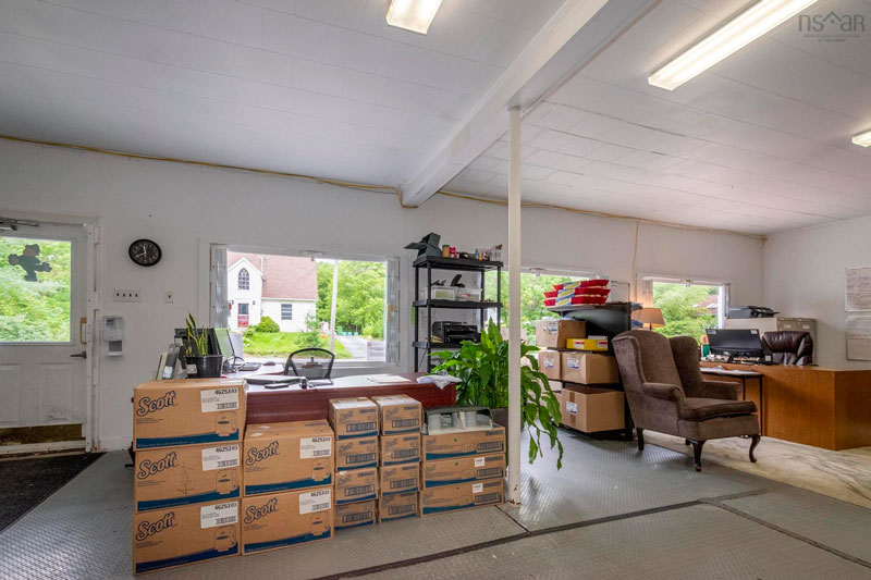 Large, open plan office area with windows